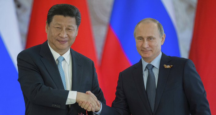 O presidente russo, Vladimir Putin reúne-se com o presidente chinês, Xi Jinping